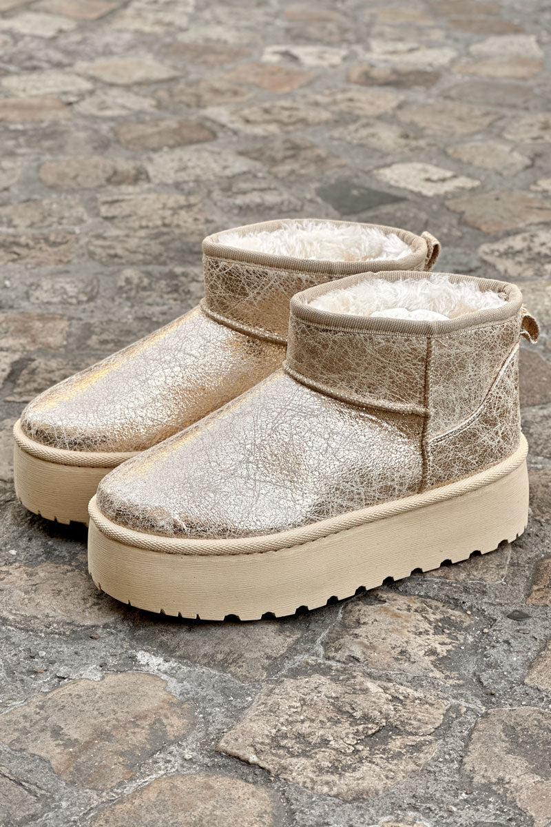 Botas de plataforma baja con forro de piel dorada