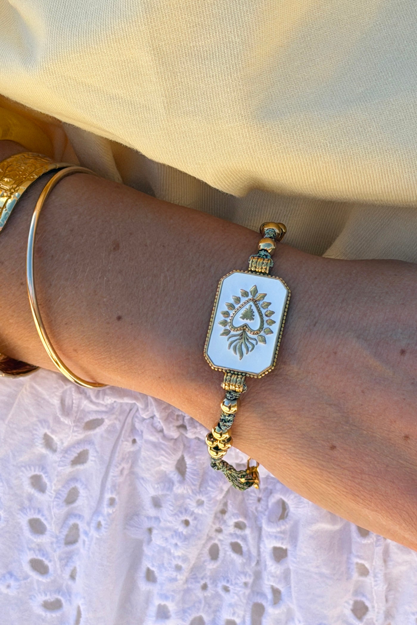 White Enamel Plaque and Gold Bead Bracelet