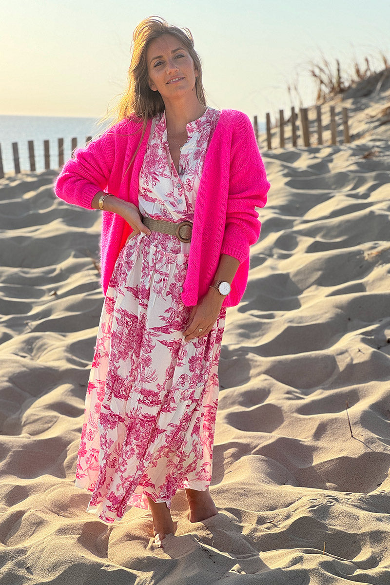 Cárdigan liso fucsia neón de punto fino con pequeños botones perlados