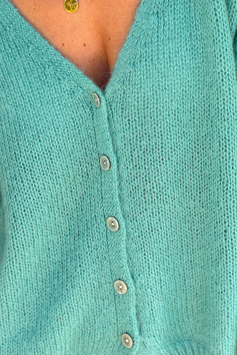 Gilet uni turquoise en maille petits boutons nacrés