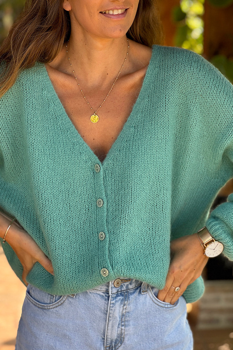Gilet uni turquoise en maille petits boutons nacrés