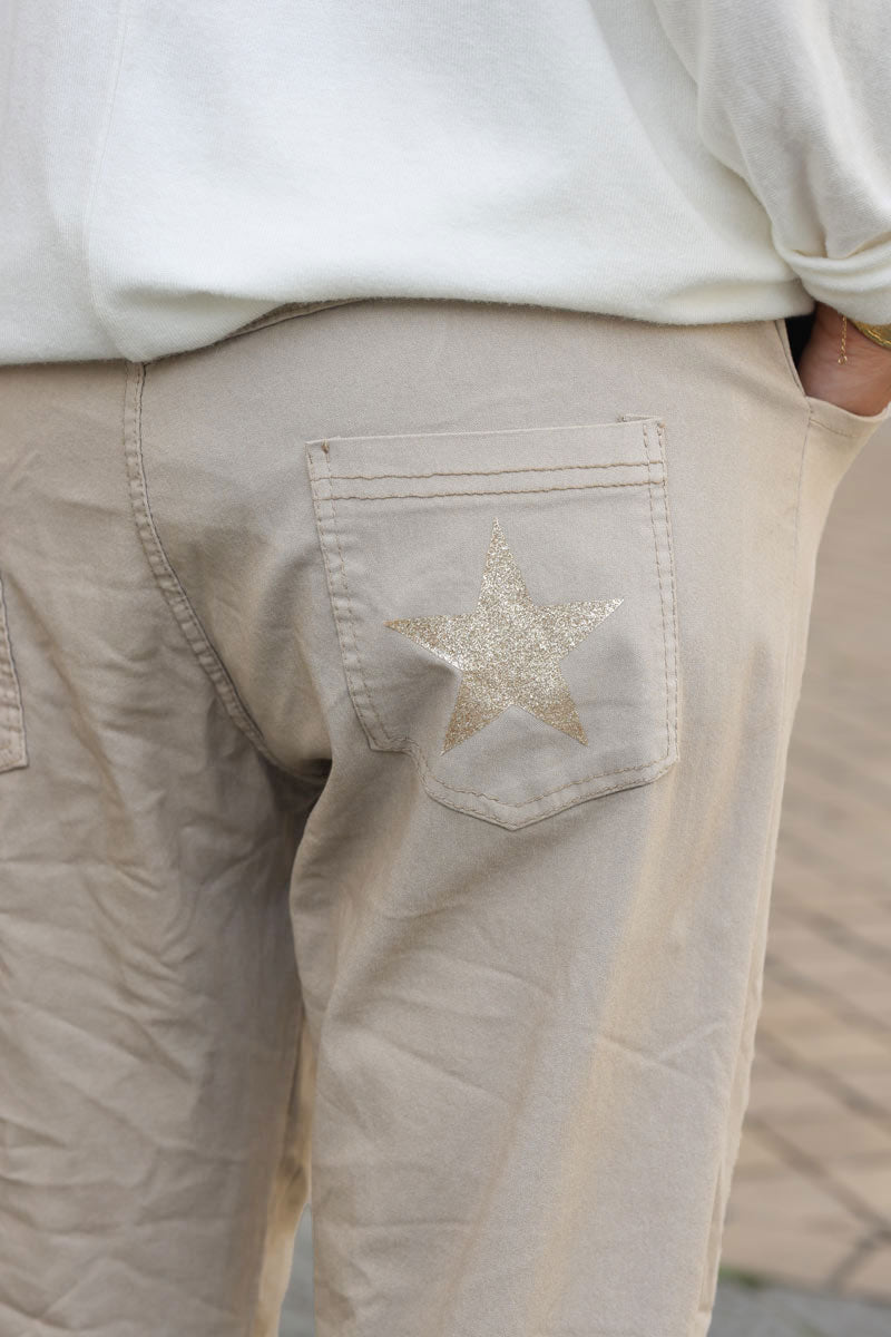 Beige comfort and stretch fabric pants with a glitter star