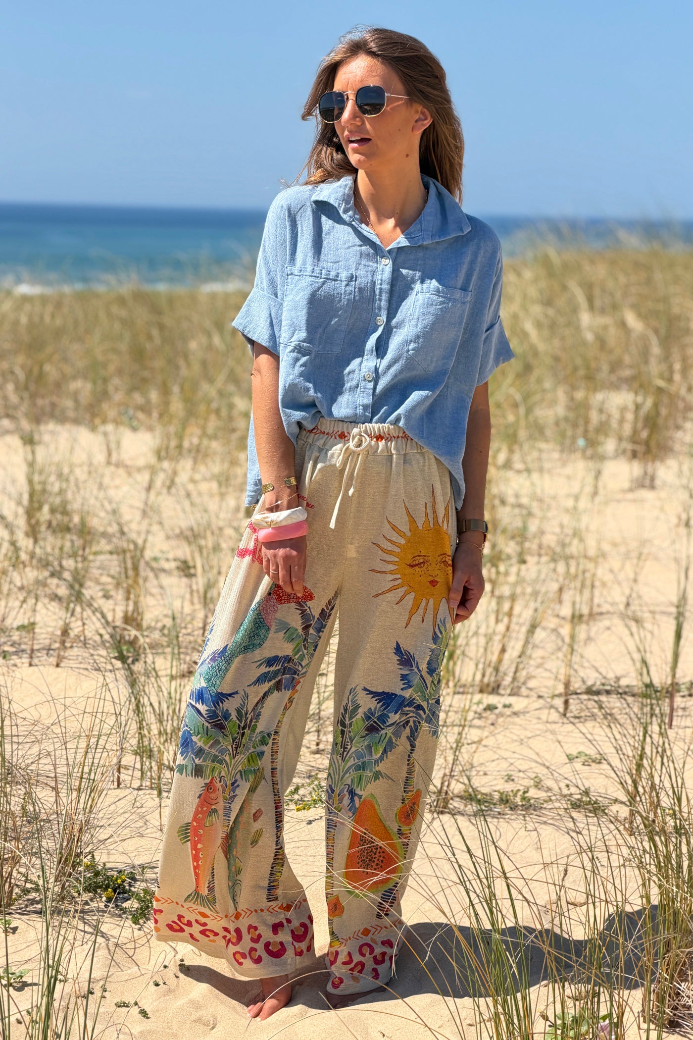 Pantalon brillant lurex large et souple imprimé tropical palmier soleil et papaye