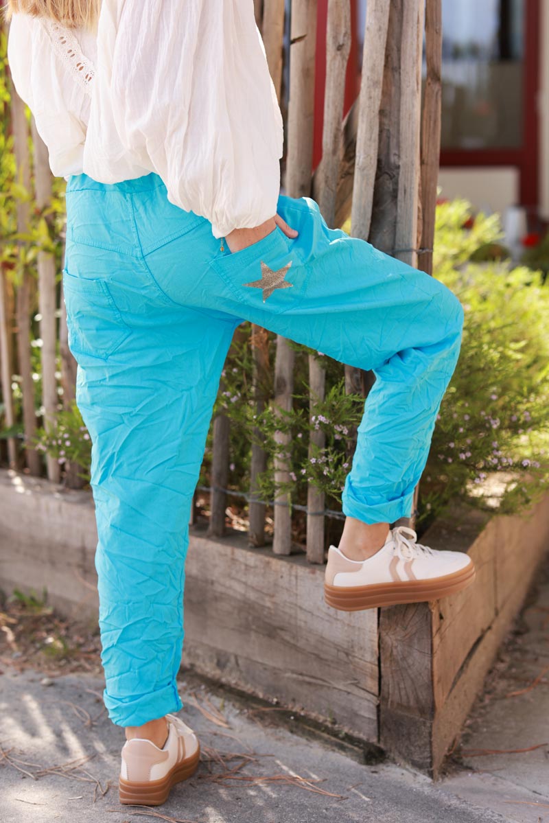 Pantalón azul celeste cómodo de lona elástica con lentejuelas de estrellas brillantes