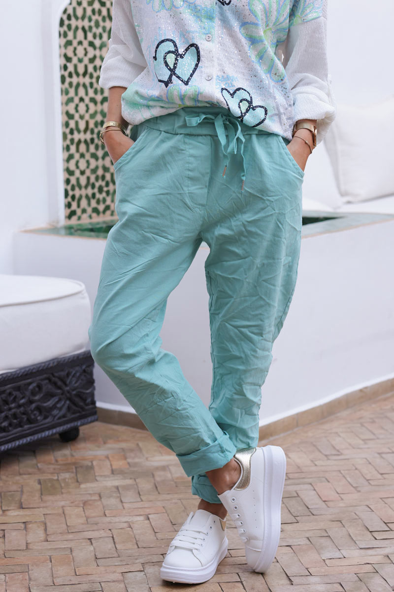 Turquoise comfort and stretch fabric pants with a glitter star
