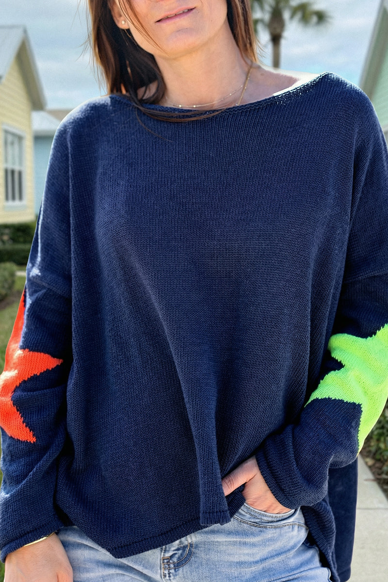 Navy blue knit sweater with colourful stars