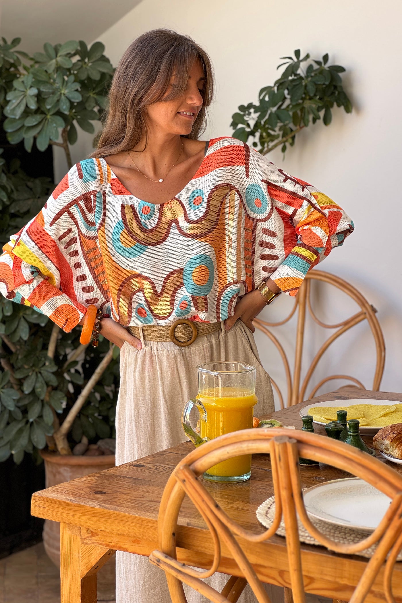 Pull petite maille imprime graphique abstrait tons orange manches chauve-souris