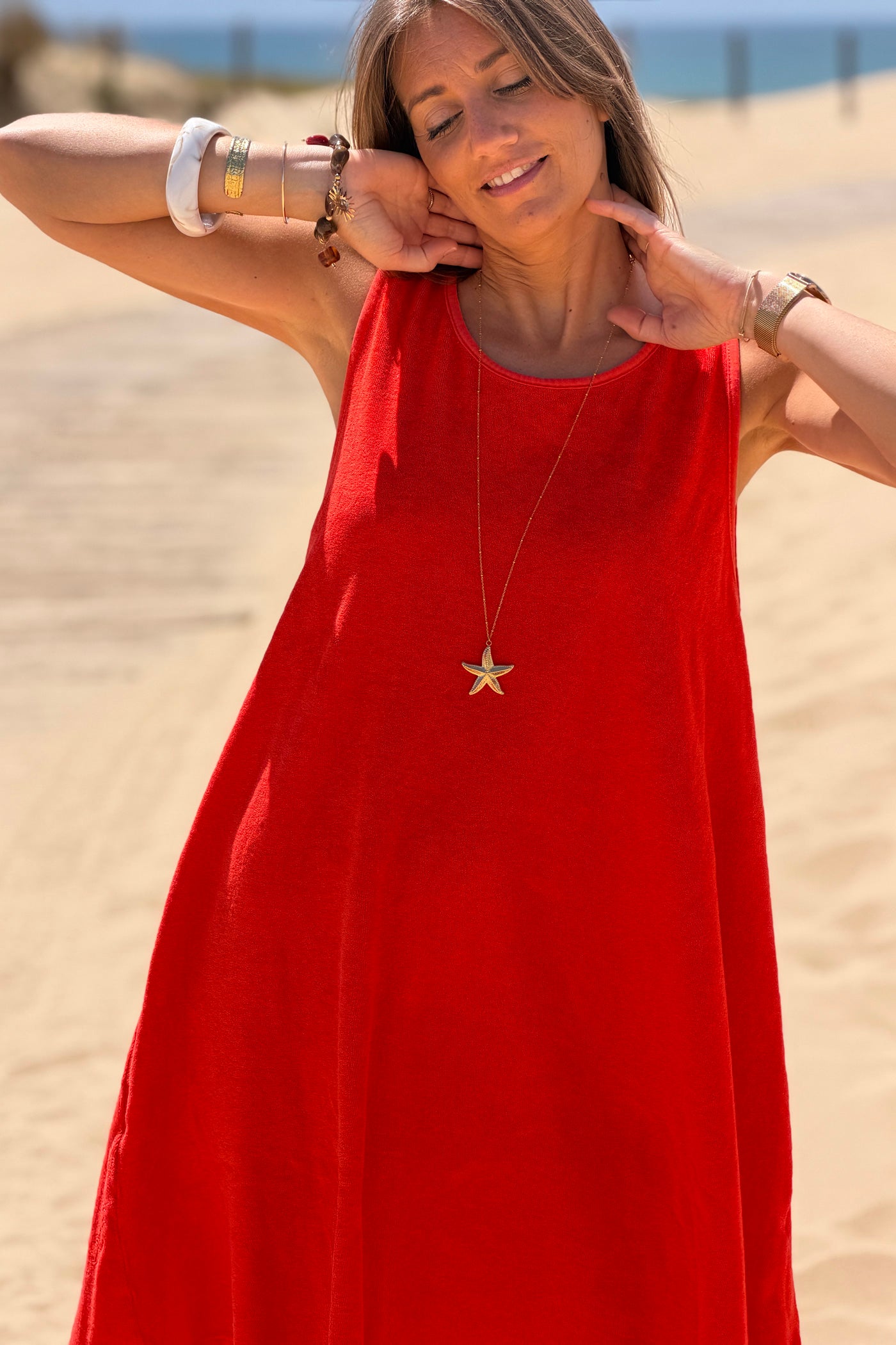Robe débardeur en éponge orange nœud tresse dans le dos décolleté
