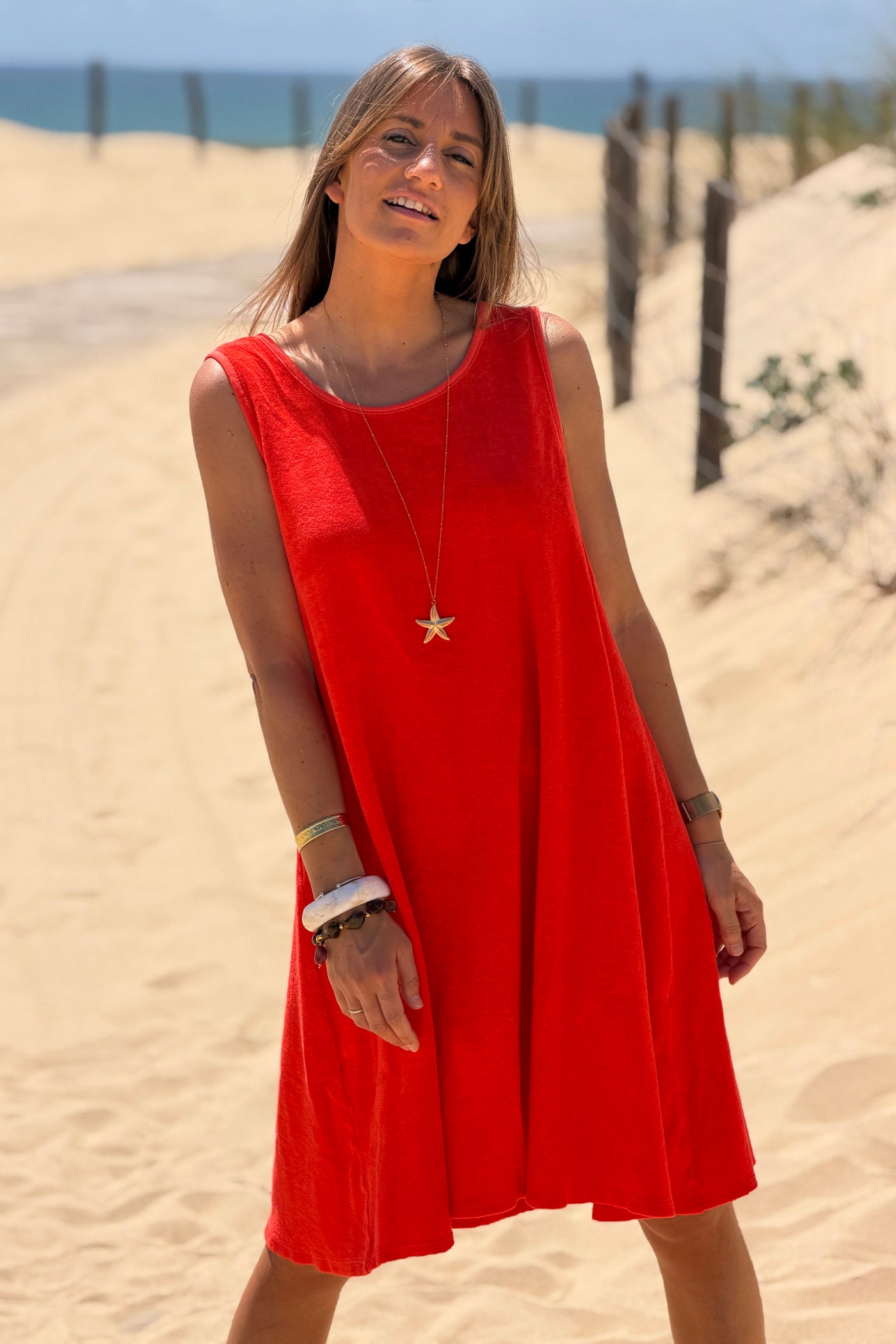 Robe débardeur en éponge orange nœud tresse dans le dos décolleté