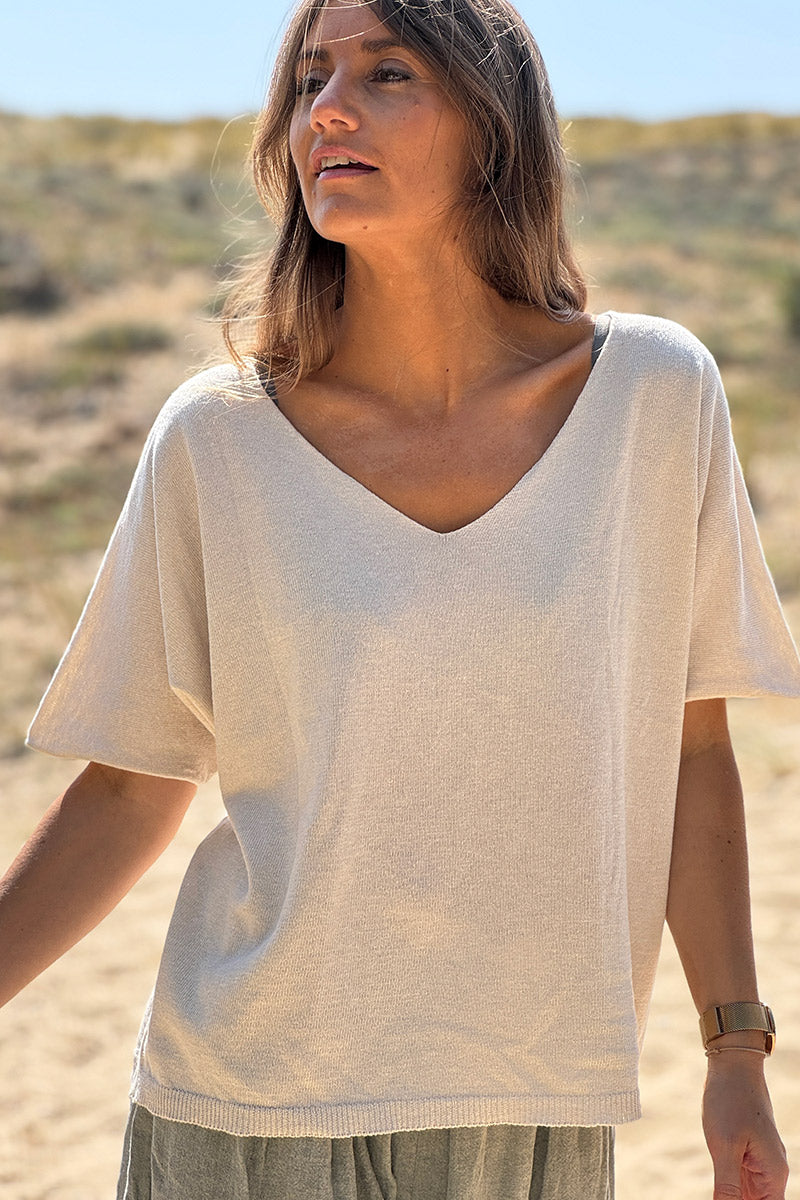 Top beige de punto en mezcla de algodón pequeño con estampado de palmeras color caqui en la espalda