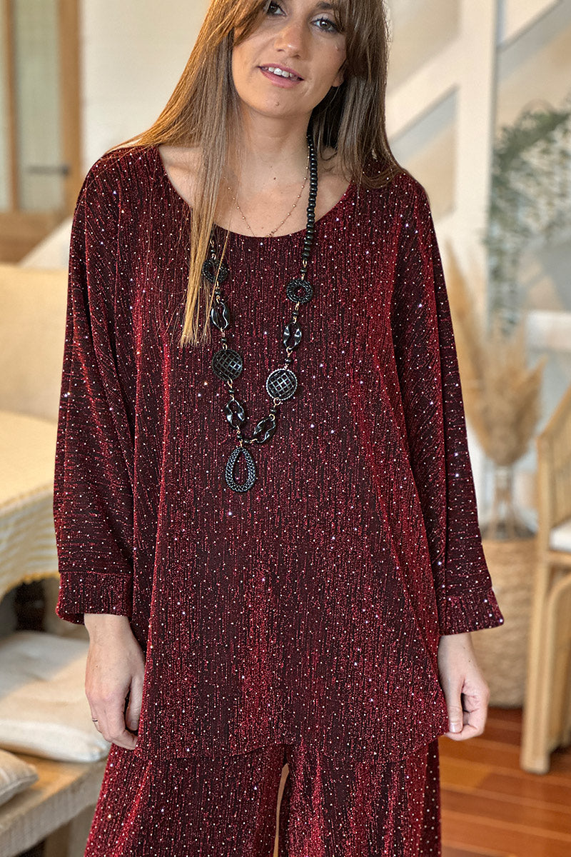 Top noir large manches chauve souris en lurex rouge avec strass pour les fêtes