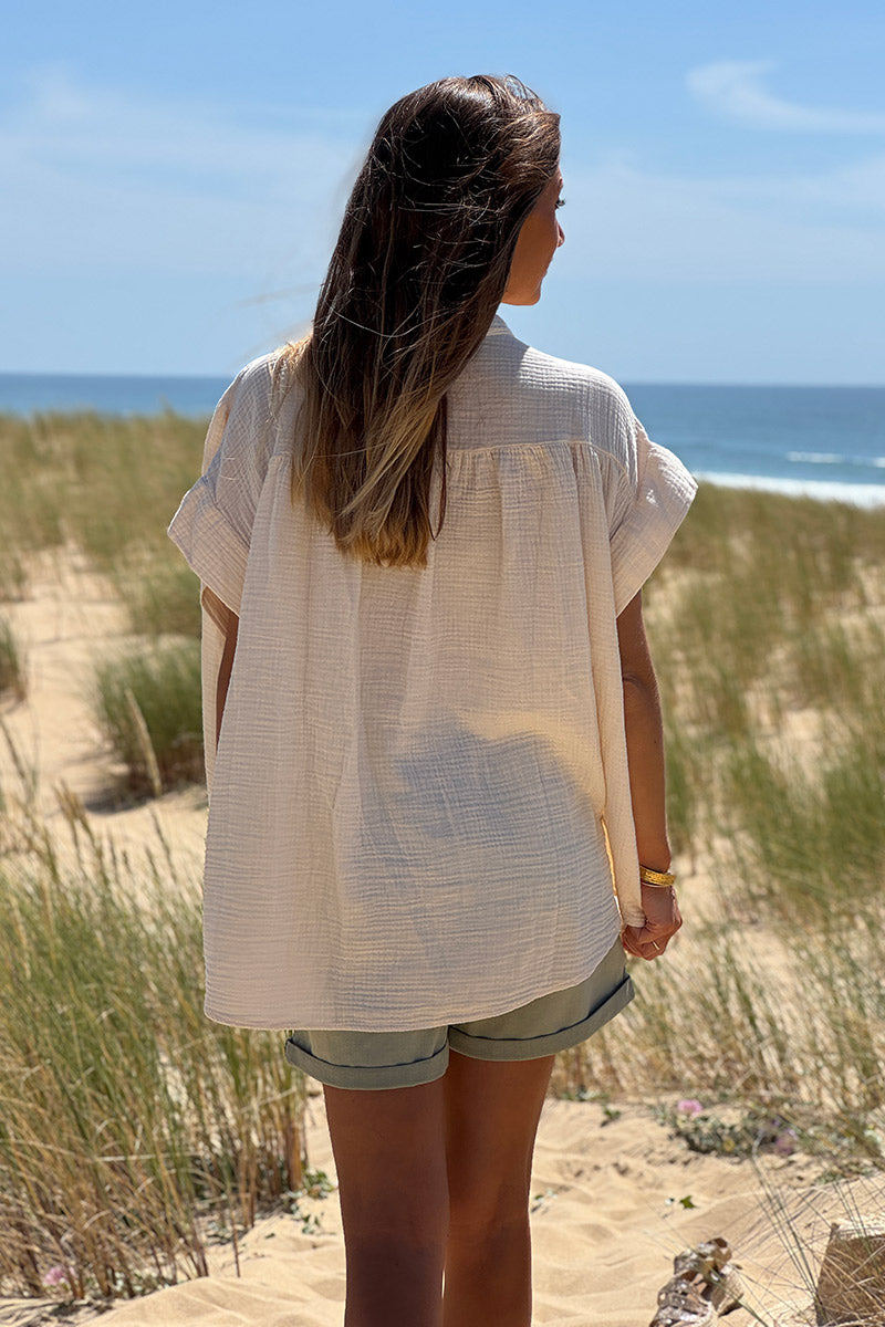 Túnica beige con botones en gasa de algodón con bordados de símbolos de verano coloridos