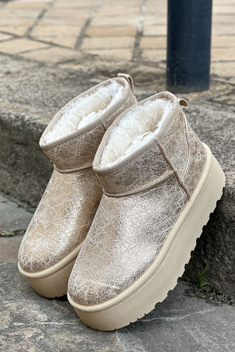 Botas de plataforma baja con forro de piel dorada