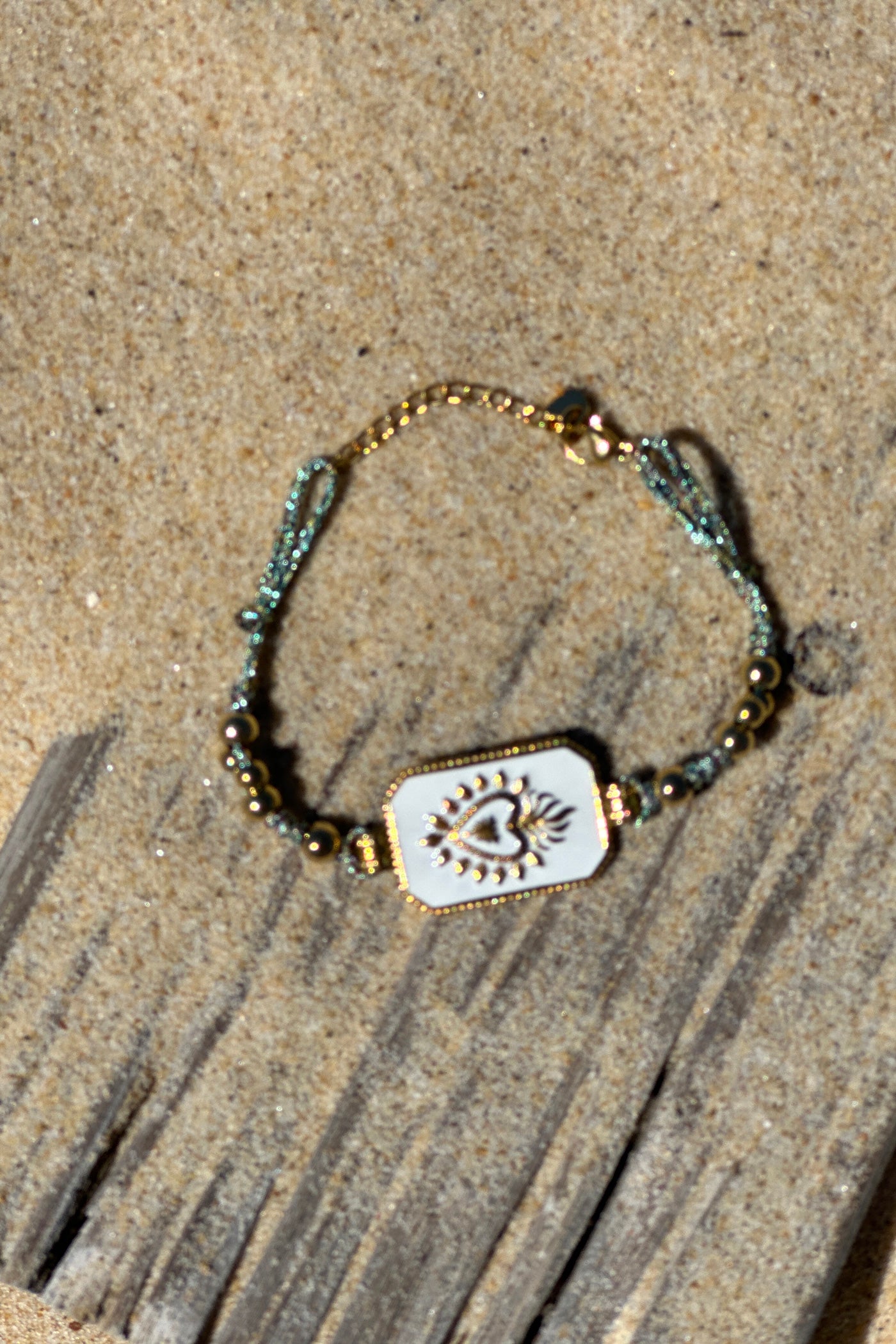 White Enamel Plaque and Gold Bead Bracelet