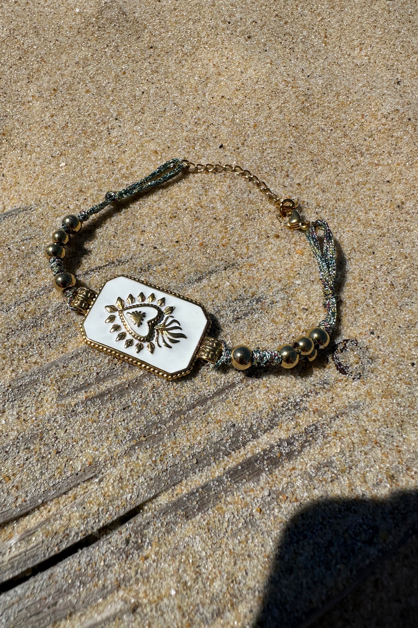 White Enamel Plaque and Gold Bead Bracelet