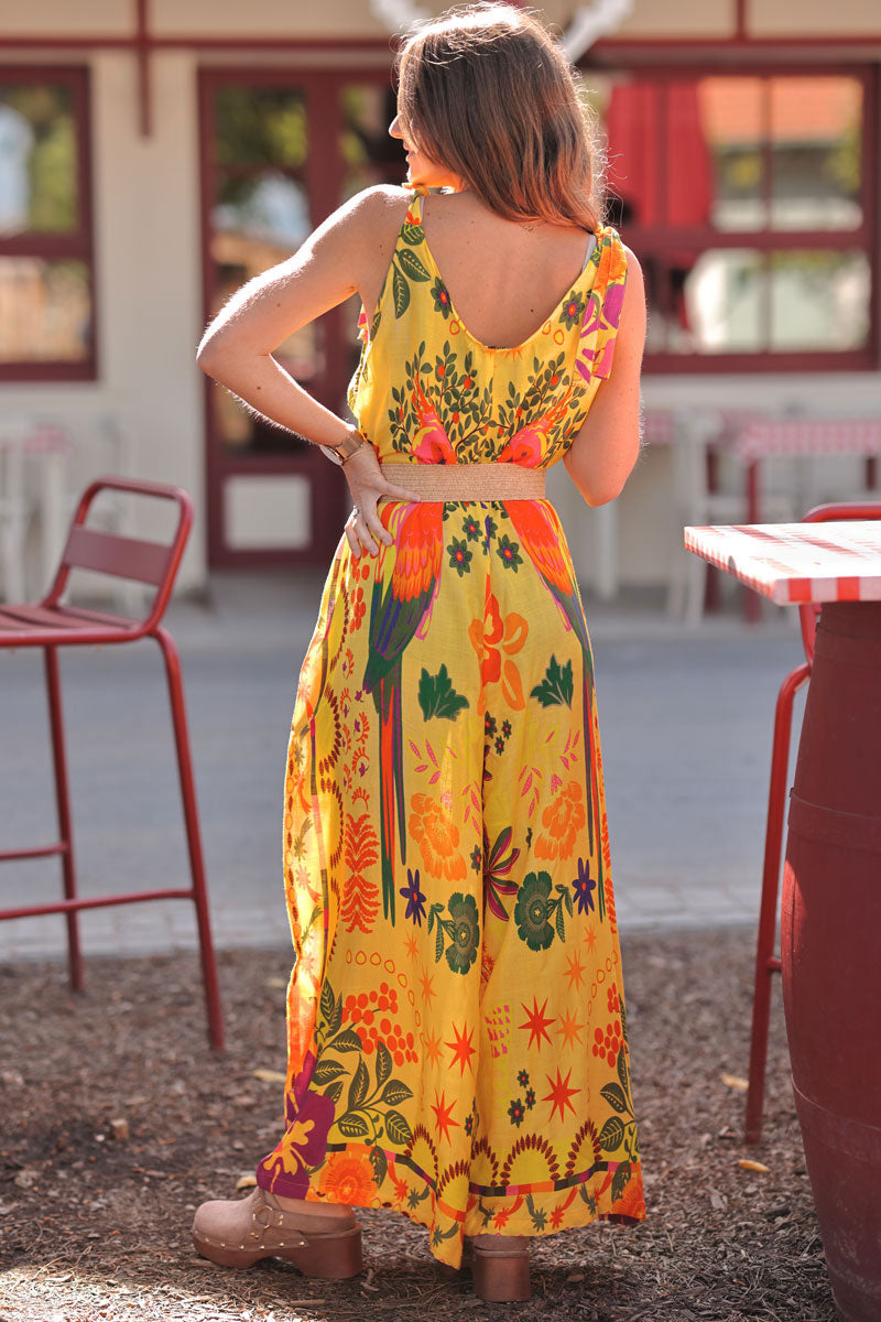 Combi pantalon jaune à bretelles nœuds imprimé perroquets et fleurs colorées