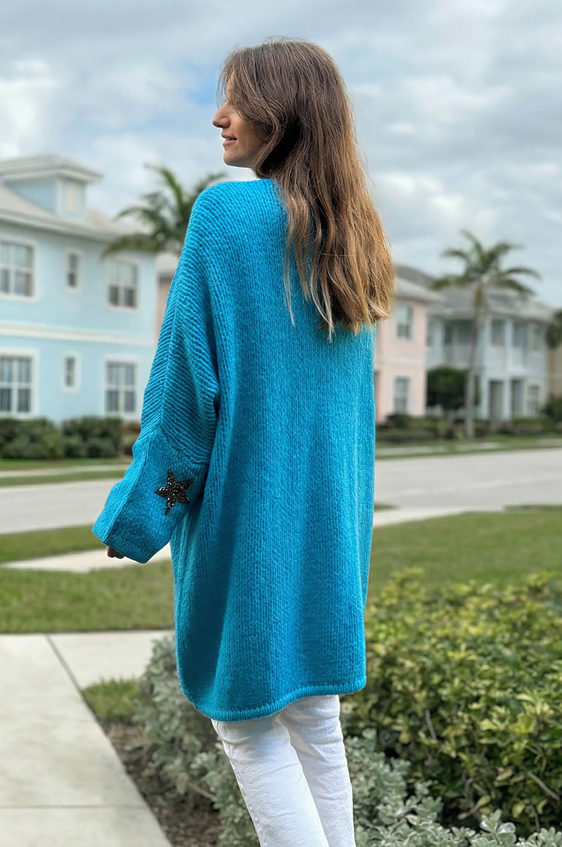 Gilet turquoise mi long grosses mailles étoile strass manches