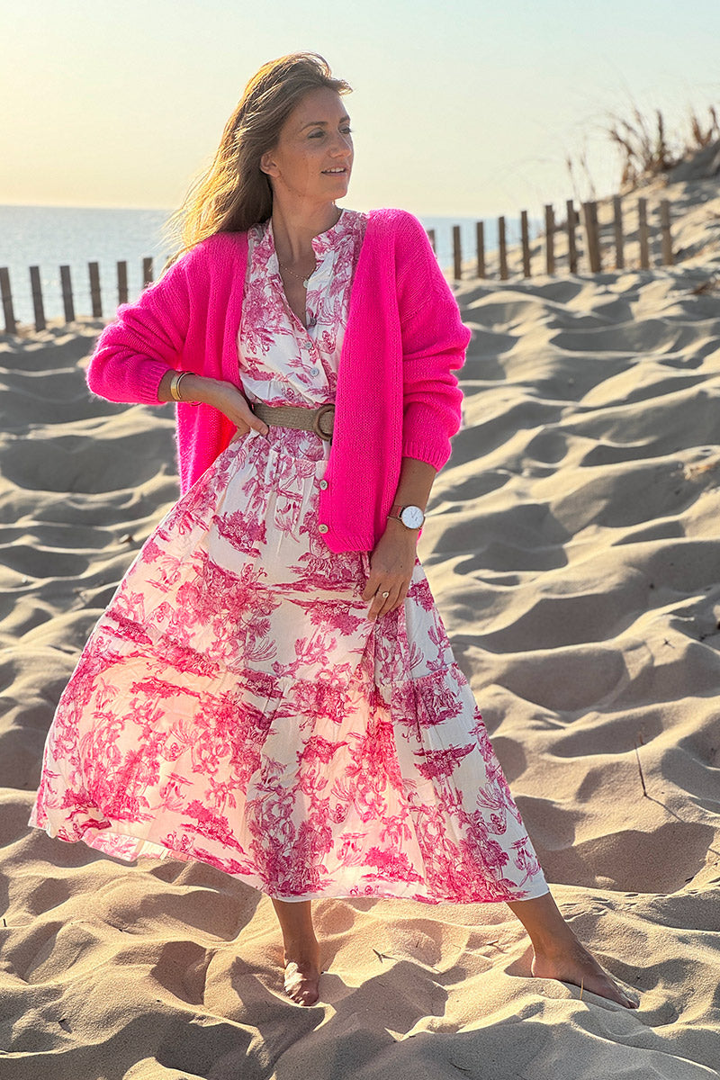 Cárdigan liso fucsia neón de punto fino con pequeños botones perlados