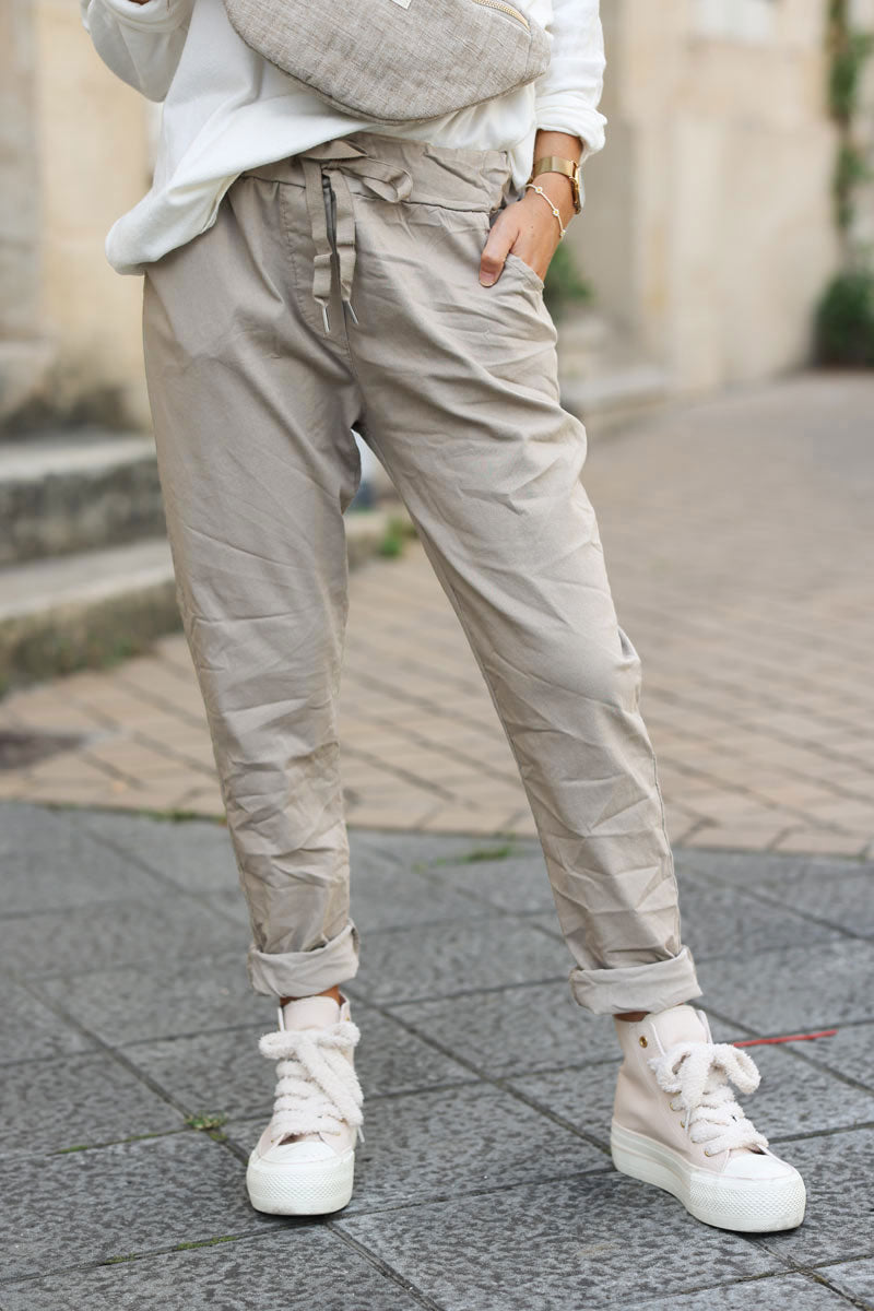 Beige comfort and stretch fabric pants with a glitter star
