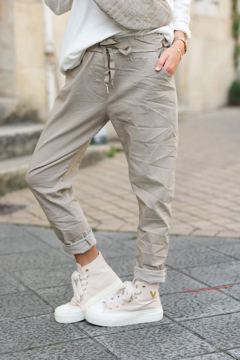 Beige comfort and stretch fabric pants with a glitter star