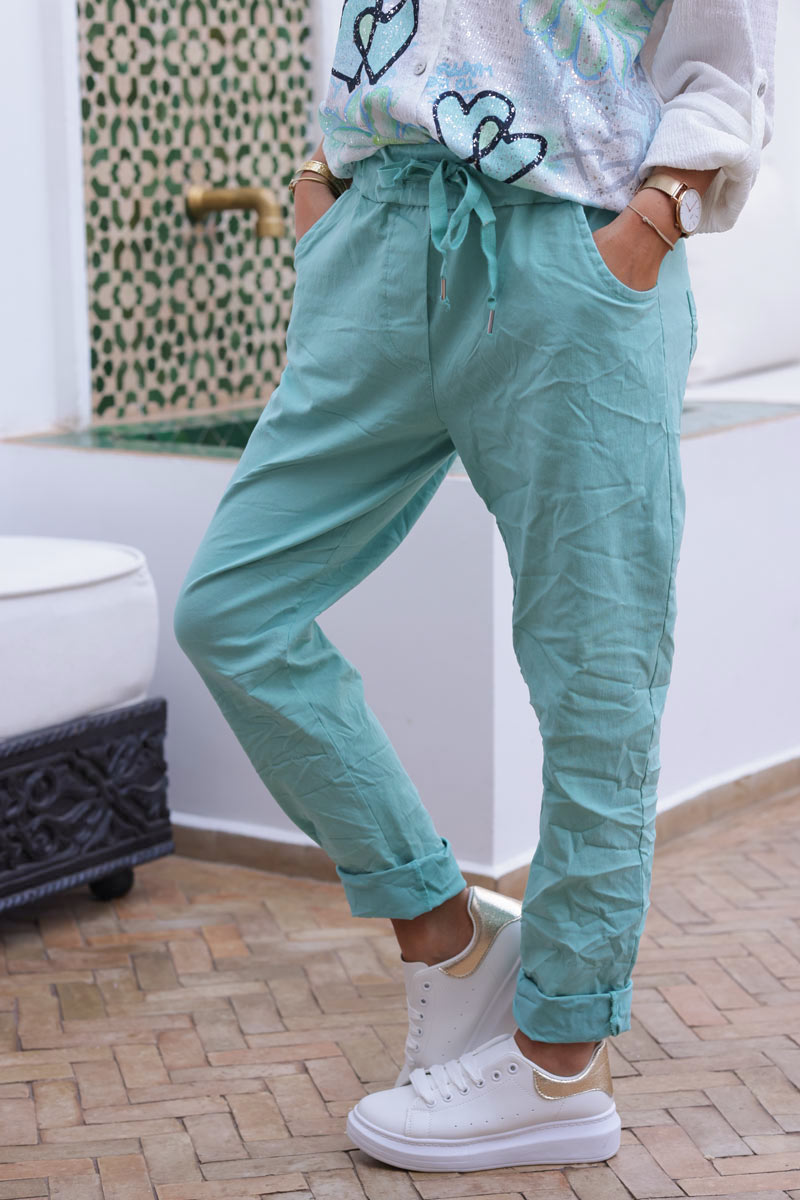 Turquoise comfort and stretch fabric pants with a glitter star