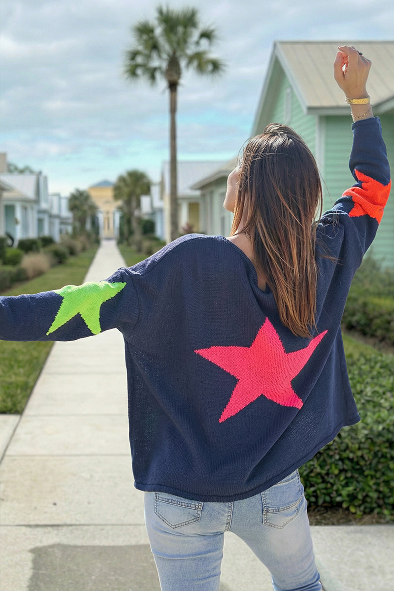 Navy blue knit sweater with colourful stars