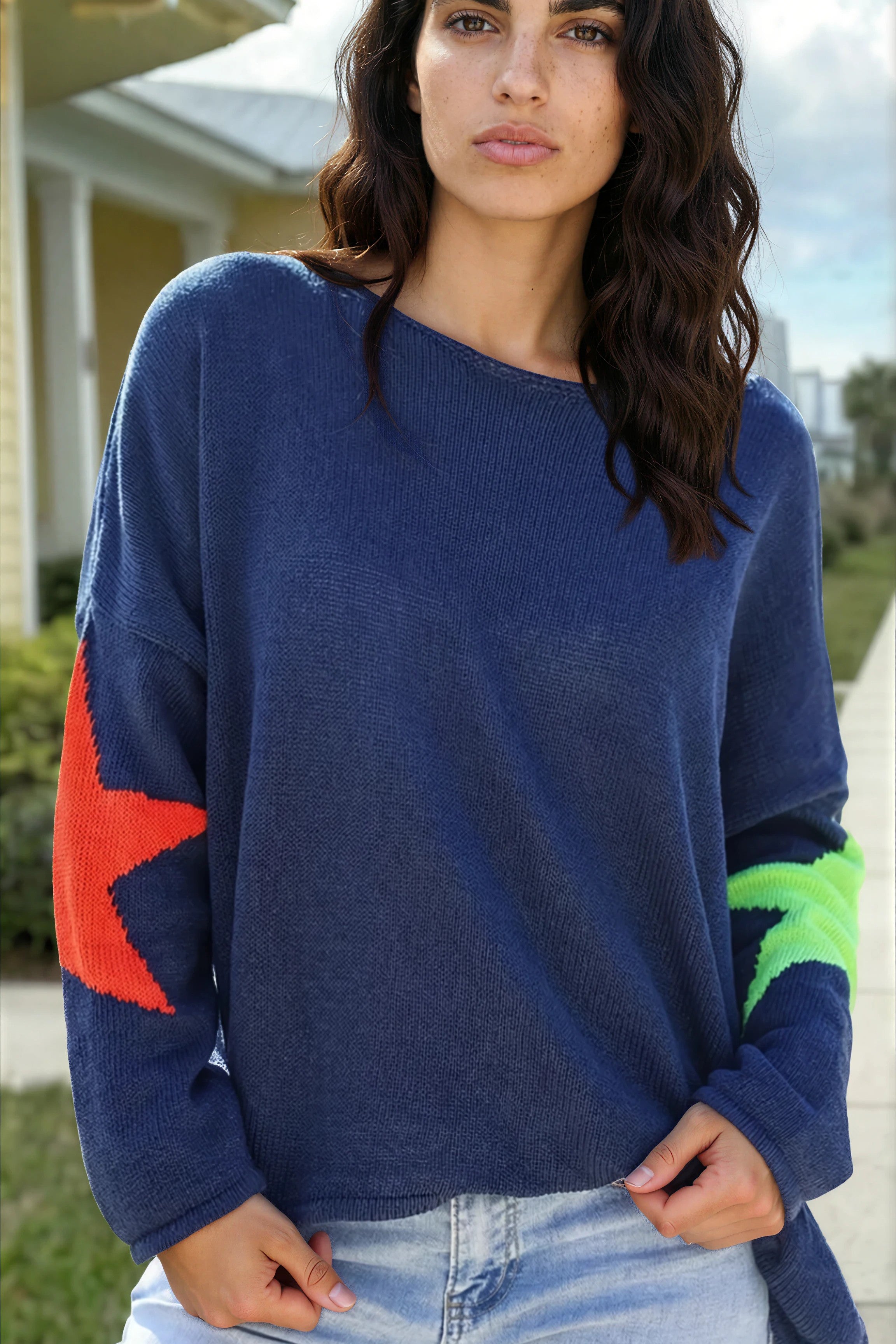 Navy blue knit sweater with colourful stars