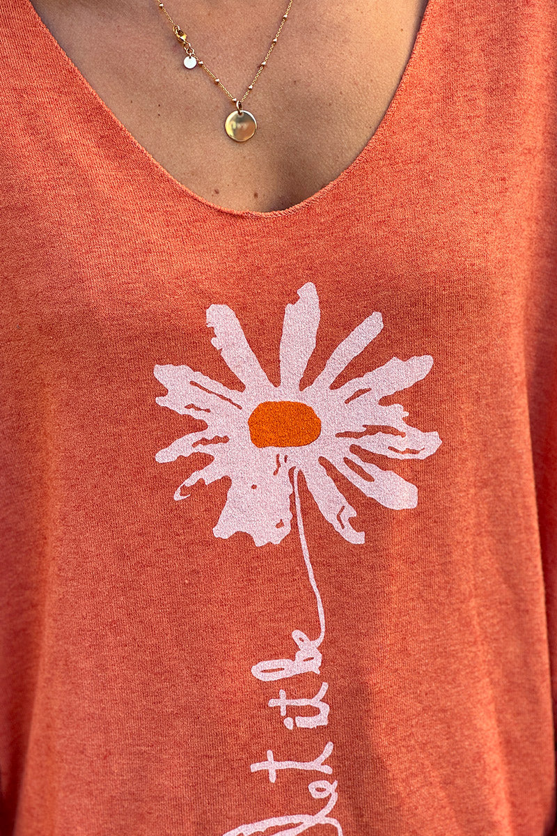 Suéter de punto suave color naranja con estampado de margaritas. Déjalo ser.