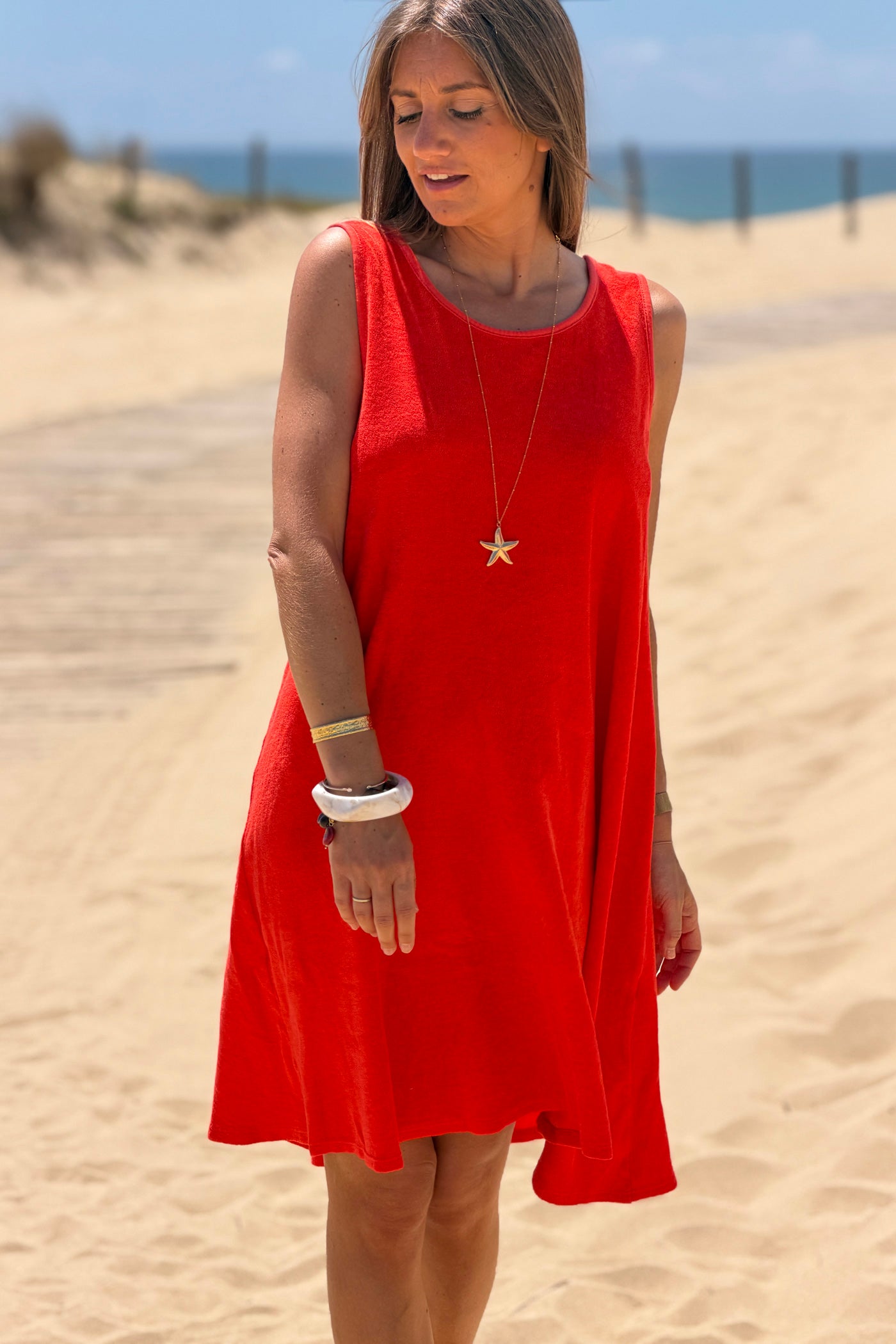 Robe débardeur en éponge orange nœud tresse dans le dos décolleté