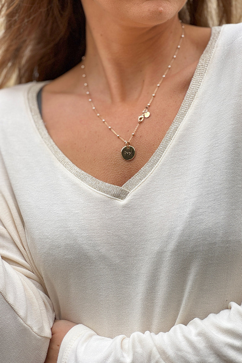 Top beige en jersey stretch col v brillant