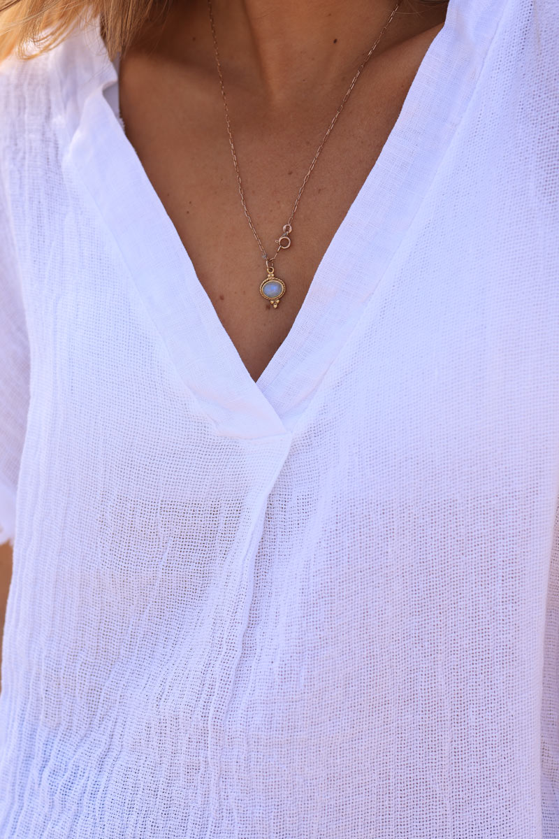 White cotton linen blend short sleeve blouse with fringed hems