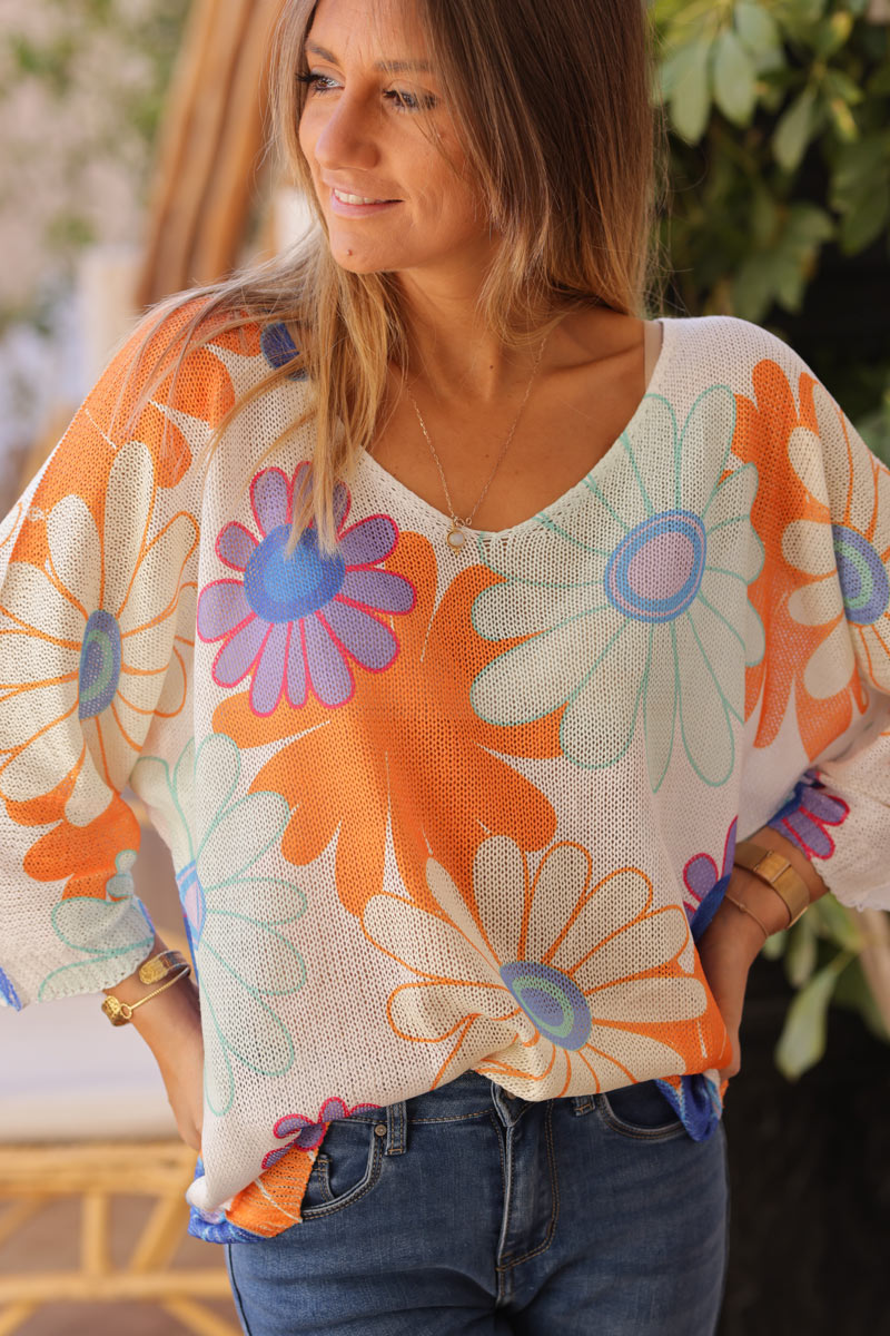 Top de punto de algodón con grandes margaritas de colores